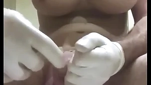 Huge butt plug with condom insertion into urethra