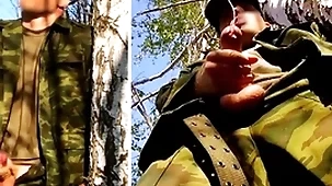 Russian soldier on every side a obese dick on a military naming in the forest shoots sperm from his penis at opponents