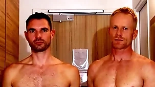 Handsome blonde fitness trainer serviced by a huge dick guy.