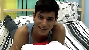 Cute twink is playing with his bushwa during an interview