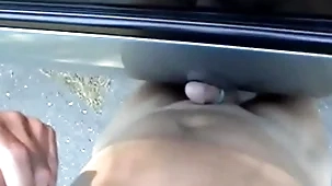 Cumming atop of a car